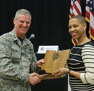Maj. Gen. Mark E. Bartman (left), Ohio adjutant general, presents a plaque of appreciation to Kimberly Brazwell, special assistant to the president for diversity initiatives at Columbus State University.
