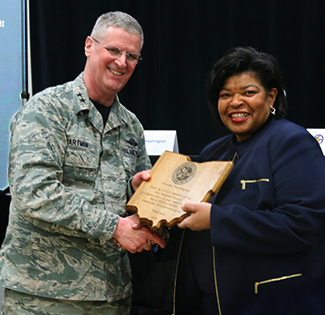 Maj. Gen. Mark E. Bartman (left), Ohio adjutant general, presents a plaque of appreciation to Lorraine Washington, senior vice president of human resources, SUMMA Health