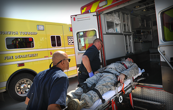 A casualty is loaded on an ambulance during an emergency preparedness exercise.