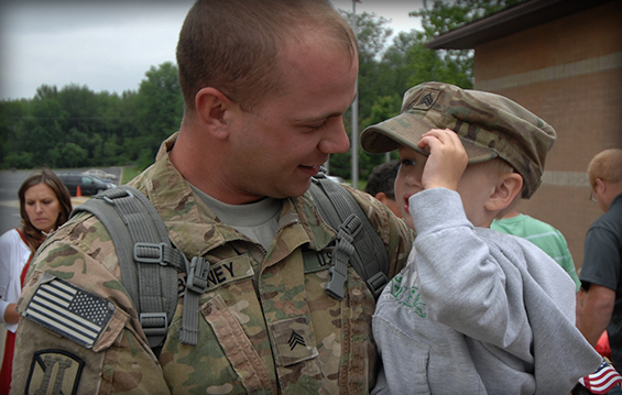 Sgt. Brandon Behney holds his son Declan, 3, as part of a welcome home ceremony