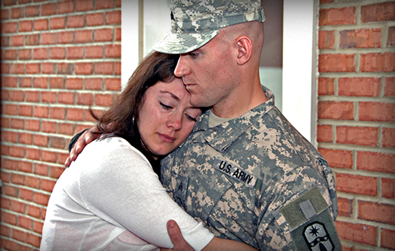 Sgt. Matt Kaufman hugs his wife, Jessica