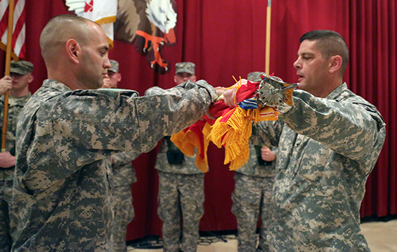 Col. Gregory W. Robinette (right), 371st Sustainment Brigade commander and a Bowling Green, Ohio, native, and Command. Sgt. Maj. Scott M. Barga, 371st Sustainment Brigade command sergeant major and a Versailles, Ohio, native, case the brigade colors during a transfer of authority ceremony 