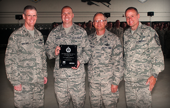 Maj. Gen. Mark E. Bartman (from left), Ohio assistant adjutant general for Air, Col. James Jones, 121st Air Refueling Wing commander, and Chief Master Sgt. Eric Wallace, 121st ARW command chief, congratulate Tech. Sgt. Todd Parkison (second from left), 121st ARW production recruiter, who was recently named the 2013 Top Non-Prior Service Accessions award winner