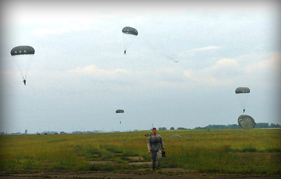 Members of the Ohio Army National Guard’s Company B, 2nd Battalion, 19th Special Forces Group (Airborne) maneuver for a landing after jumping from more than 1,000 feet.