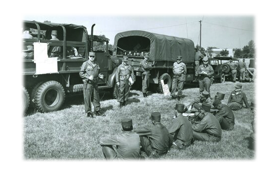 Ohio Army National Guard Col. John Lavko gives a convoy brief to Soldiers before movement to annual training in 1960.