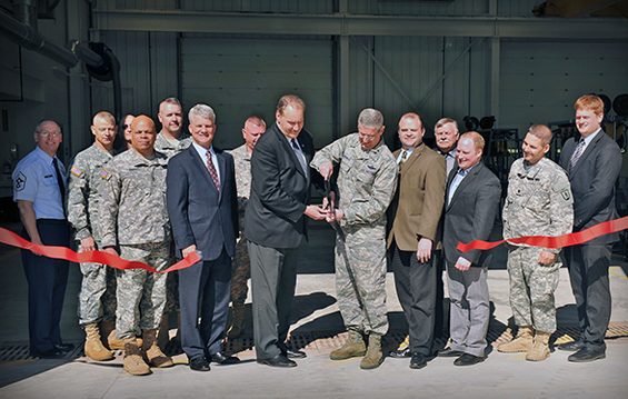 Maj. Gen. Mark E. Bartman (center, right), Ohio adjutant general, and Chillicothe Mayor Jack Everson (center, left), conduct the official ribbon cutting for Field Maintenance Shop 9.