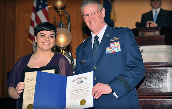Madison Bailey (left) receives a proclamation on behalf of Gov. John Kasich from Maj. Gen. Mark E. Bartman, Ohio adjutant general, recognizing her as the Ohio Military Child of the Year.