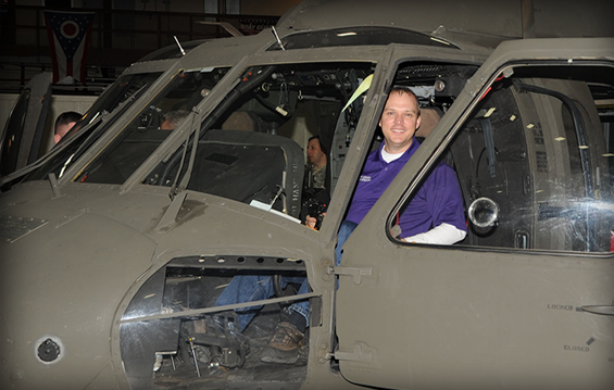Corby Leach, a Logan-Hocking Local School District Board of Education member, sits in a UH-60 Black Hawk helicopter during the 2015 Ohio National Guard Educator Orientation Flight.