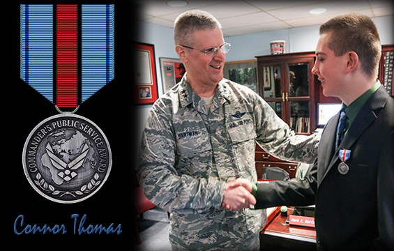 Maj. Gen. Mark E. Bartman (left), Ohio adjutant general, presents Connor Thomas with the Air Force Commander’s Public Service Award.