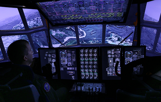 Capt. Kevin Loughrin, a pilot with the 179th Airlift Wing in Mansfield, Ohio, operates a simulated C-130H Hercules.