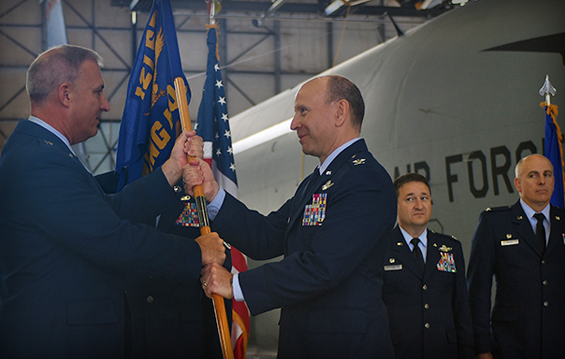 Col. Mark Auer (right) receives the 121st Air Refueling Wing organizational flag from Brig. Gen. Stephen Markovich, commander of the Ohio Air National Guard.