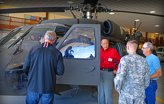 Civilian health care providers check out a UH-60 Black Hawk helicopter during an orientation tour.