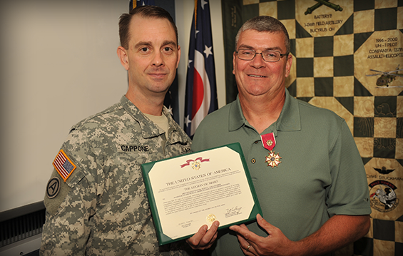 Col. Mark J. Cappone, Ohio National Guard Army Chief of Staff, awarded the Legion of Merit to retired Lt. Col. Scott Gallaugher.