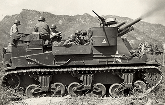 The "Red Bulls," as they were known, fire a 105 mm Self Propelled Gun on a Communist target in Korea. 