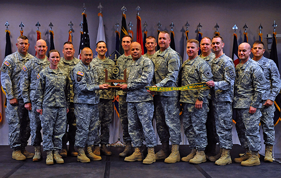 Army Brig. Gen. James P. Wong (fifth from left), special assistant to the director of the Army National Guard, presents to members of the Ohio Army National Guard the 2015 Army Communities of Excellence Overall Winner award.