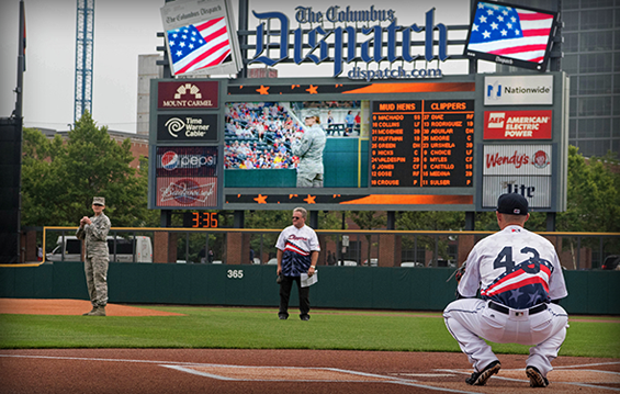 Staff Sgt. Jennifer Masters, an Airman with the 178th Wing, throws out the ceremonial first pitch during the Columbus Clippers’ military appreciation night.