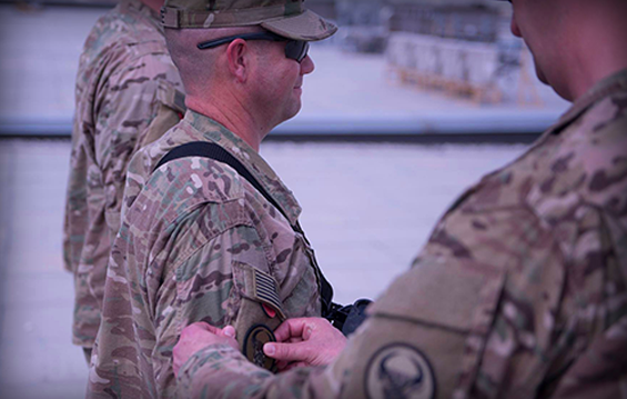 Soldiers from the 204th Engineer Detachment receive their "combat patches" 