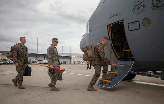 Marines with Special Purpose Marine Air-Ground Task Force-Southern Command and Soldiers from 1st Battalion, 228th Aviation Regiment prepare to depart Kingston, Jamaica, for Port-au-Prince, Haiti, in an Ohio Air National Guard C-130H Hercules.