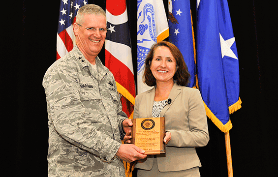 Maj. Gen. Mark E. Bartman, (left), Ohio adjutant general, presents guest speaker Kim Amrine, director of diversity and inclusion for Frost, Brown & Todd Attorneys, with a plaque.