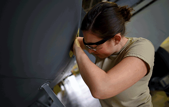 Staff Sgt. Belinda Todd of the 121st Air Refueling Wing installs a new antenna on a KC-135 Stratotanker.