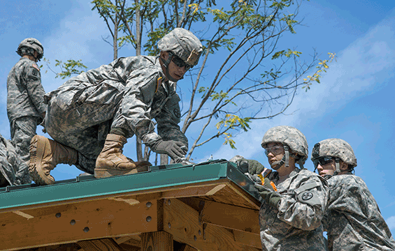 Members of the 1194th Engineer Company (Horizontal) build a shelter at Range 9, the Known Distance and Zero Range, during Annual Training ’16 at Camp Ravenna Joint Military Training Center .