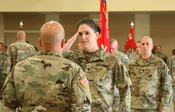 Col. Jennifer Mitchell (saluting), incoming commander of the 16th Engineer Brigade, assumes command of the formation from Maj. Gen. John C. Harris Jr, Ohio assistant adjutant general for Army.