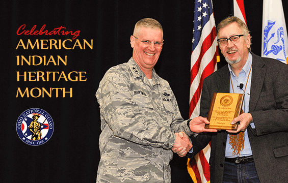 Maj. Gen. Mark E. Bartman, (left), Ohio adjutant general, presents a plaque to Dr. Jon Low, associate professor and chairperson of the dean’s advisory council on diversity and inclusion for The Ohio State University.