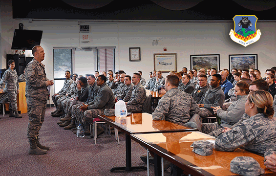 New 178th Wing commander, talks in front of  first-term Airmen in classroom setting.