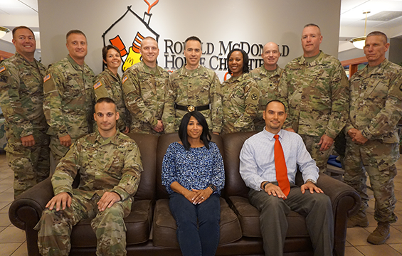 Group photo of members of the Ohio Army National Guard Warrant Officer Candidate School with Kidd's widow in center.