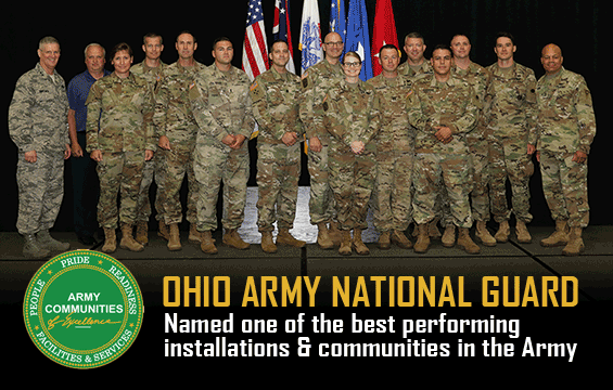Ohio National Guard members affiliated with award, stand on stage to be recognized.