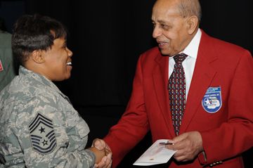 Chief Master Sgt. Tamara Phillips, Ohio Air National Guard command chief master sergeant, greets Dr. Dr. Harry Brown, an original Tuskegee Airman and Columbus, Ohio, native,