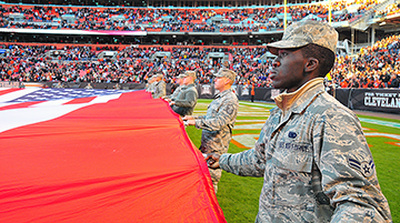 Airmen help display American flag