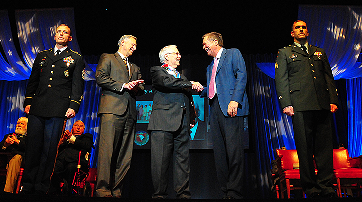 Gov. Kasich shakes hands with Award recipient