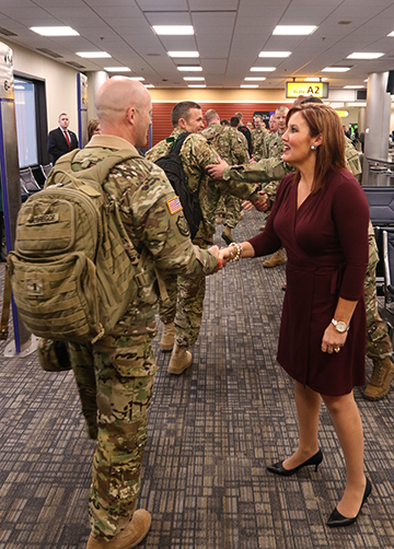 Ohio Lt. Gov. Mary Taylor (right) greets members of the Ohio Army National Guard’s 1st Battalion, 137th Aviation Regiment.