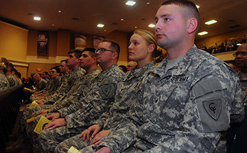 Soldiers listen to speakers during call to duty ceremony