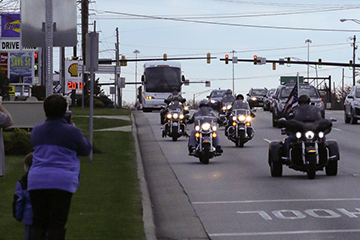 Members of the Patriot Guard Riders escort Soldiers of the 1st Battalion, 174th Air Defense Artillery Regiment.