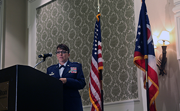 Lt. Col. Ann-Maria Coghlin, commander of the 178th Mission Support Group, Ohio Air National Guard, addresses the audience.