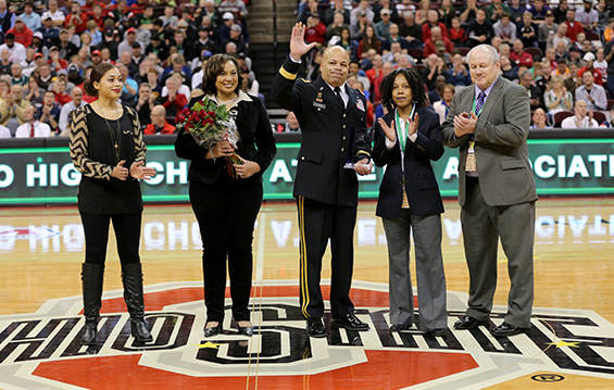 Maj. Gen. John C. Harris Jr., (center), Ohio assistant adjutant general for Army, receives the Ohio High School Athletic Association’s Sportsmanship, Ethics and Integrity award during the Boys Basketball Division I state championship game.