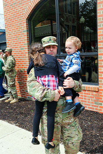 A Soldier with the 371st Sustainment Brigade spends time with loved ones.