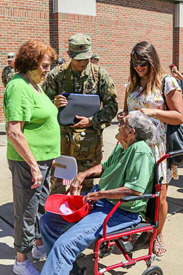 Family members greet the Soldiers.