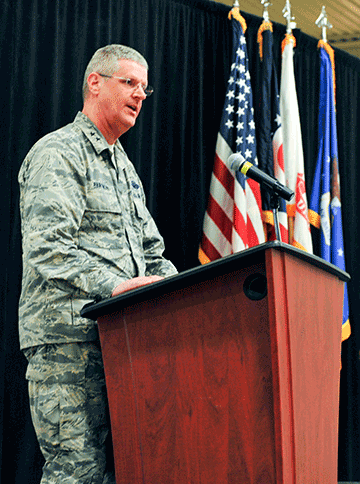 Maj. Gen. Mark E. Bartman stands at podium.