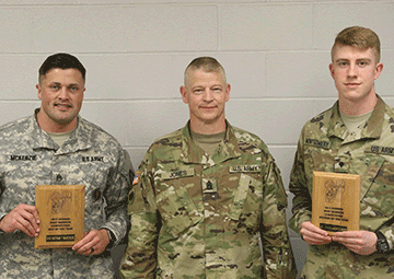Staff Sgt. Nathan McKenzie (left) and Spc. Tyson Montgomery (right) stand with Ohio Army National Guard State Command Sgt. Maj. Rodger M. Jones after winning the 2017 Best Warrior Competition March 25, 2017. 