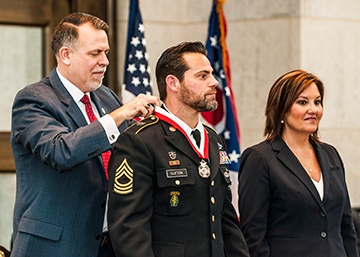 Retired Master Sgt. Sean Clifton (center), formerly of Company B, 2nd Battalion, 19th Special Forces Group, is inducted into the Ohio Military Hall of Fame for Valor.