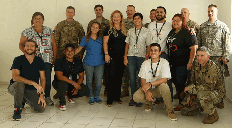 Group photo of behavioral health professionals from the Ohio National Guard and U.S. Public Health Service and students from the Ponce Health Sciences University.