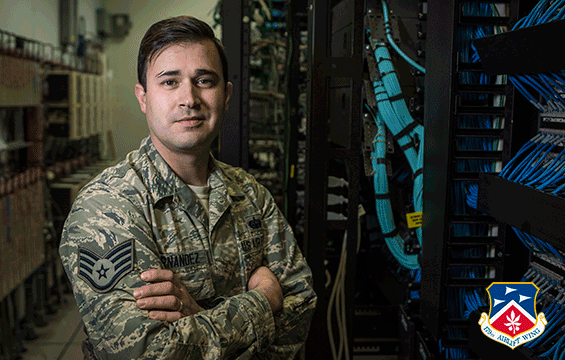 Staff Sgt. Arsenio H. Hernandez, a cyber security specialist at the 179th Airlift Wing Communications Squadron, poses for photo in control room.