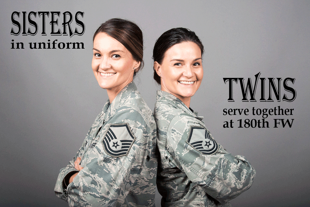 Twin Airmen sit back to back.