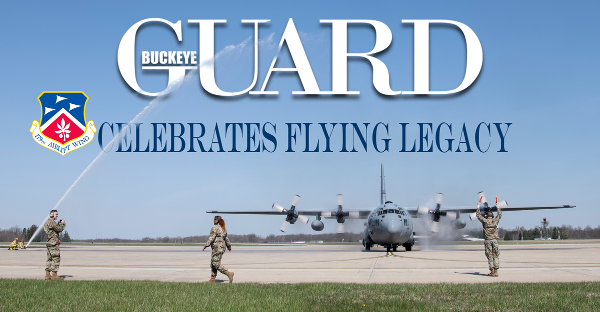 Cover of May/June 2022 Buckeye Guard Online Publication. Airmen guide C-130 on tarmac while fire fighters spray aircraft.