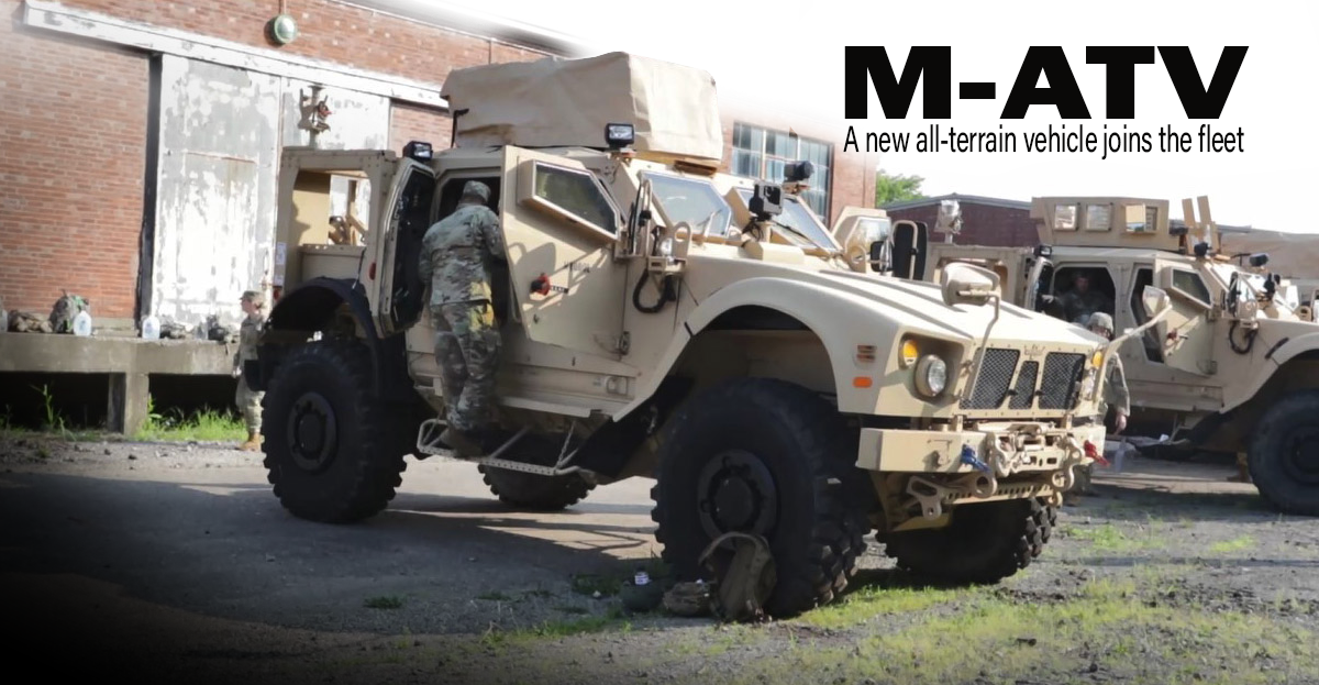 Soldier climbing into M-ATV.
