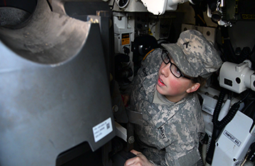 Sgt. Emma Briggs works inside an M-1 Abrams tank.