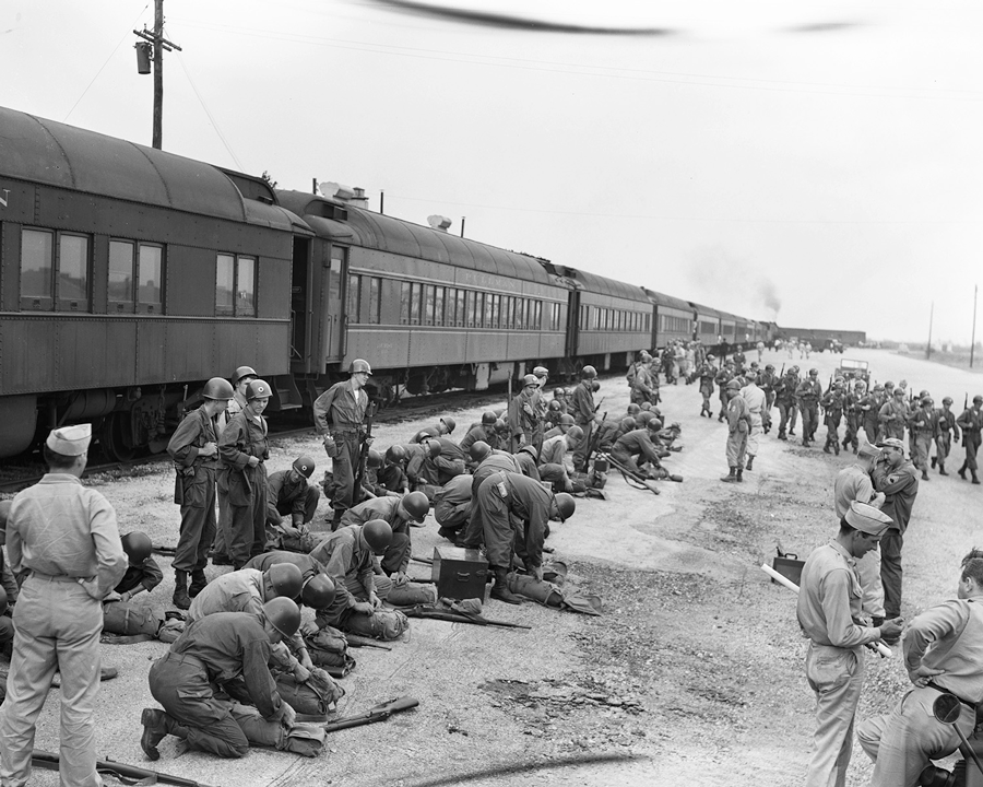 Soldiers from the 37th Infantry Division arrange their equipment after arriving at annual field training in 1948 via train. Despite shortages of equipment and supplies and reduced strength authorizations due to budget limitations, the 37th Infantry Division maintained its reputation as one of the better National Guard divisions during the post-war reorganization period. 